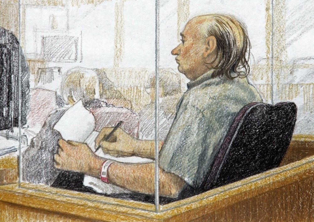 An artist's sketch shows accused serial killer Robert Pickton taking notes during the second day of his trial in B.C. Supreme Court in New Westminster, B.C., Tuesday January 31, 2006. THE CANADIAN PRESS/Jane Wolsack