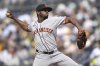 San Francisco Giants relief pitcher Joel Peguero works against a San Diego Padres batter during the seventh inning of a baseball game Thursday, Aug. 21, 2025, in San Diego. (AP Photo/Orlando Ramirez)