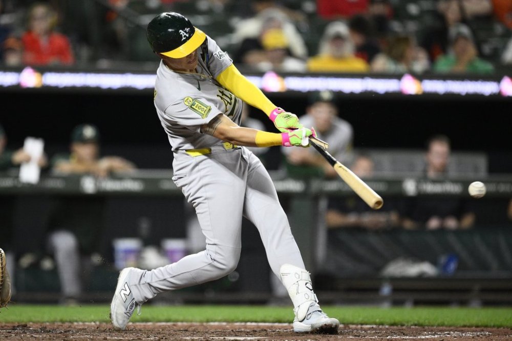 Athletics' Gio Urshela breaks his bat as he lines out during the seventh inning of a baseball game against the Baltimore Orioles, Saturday, Aug. 9, 2025, in Baltimore. (AP Photo/Nick Wass)