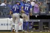 Toronto Blue Jays' Bo Bichette (11) is helped off the field by Isiah Kiner-Falefa (7) after being tagged out at home during the sixth inning of a baseball game against the New York Yankees, Saturday, Sept. 6, 2025, in New York. (AP Photo/Adam Hunger)