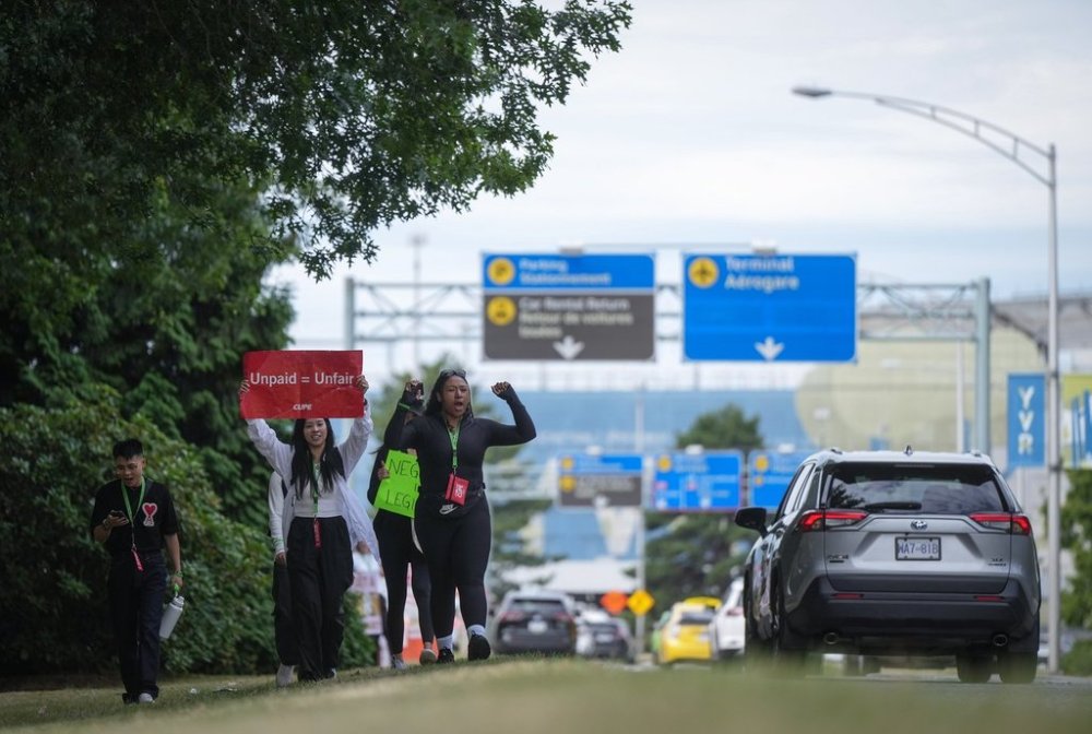 Striking Air Canada flight attendants rally at Vancouver International Airport, in Richmond, B.C., on Monday, Aug. 18, 2025. THE CANADIAN PRESS/Darryl Dyck