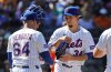 New York Mets manager Carlos Mendoza (64) takes the ball from pitcher Kodai Senga (34) during the fifth inning of a baseball game against the Miami Marlins, Sunday, Aug. 31, 2025, in New York. (AP Photo/Noah K. Murray)