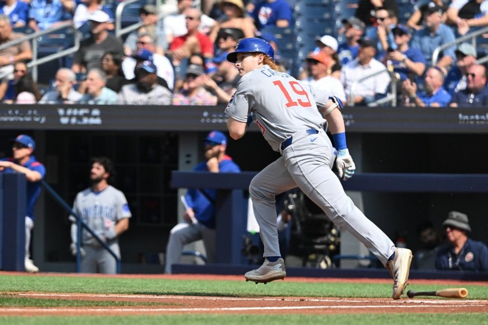 Chicago Cubs designated hitter Owen Caissie (19) hits a flyout in his major-league debut against the Blue Jays in MLB action in Toronto on Thursday, Aug. 14, 2025. THE CANADIAN PRESS/Jon Blacker
