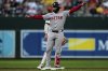 Boston Red Sox's Connor Wong, front, celebrates after hitting a double during the third inning of a baseball game against the Baltimore Orioles, Monday, Aug. 25, 2025, in Baltimore. (AP Photo/Stephanie Scarbrough)