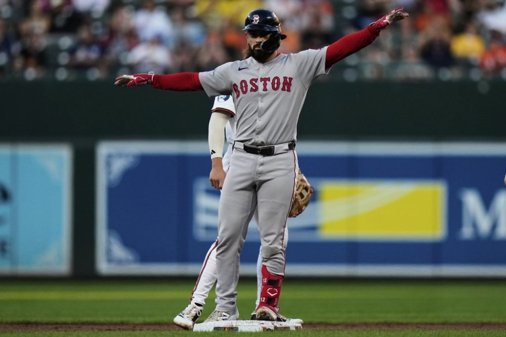 Boston Red Sox's Connor Wong, front, celebrates after hitting a double during the third inning of a baseball game against the Baltimore Orioles, Monday, Aug. 25, 2025, in Baltimore. (AP Photo/Stephanie Scarbrough)