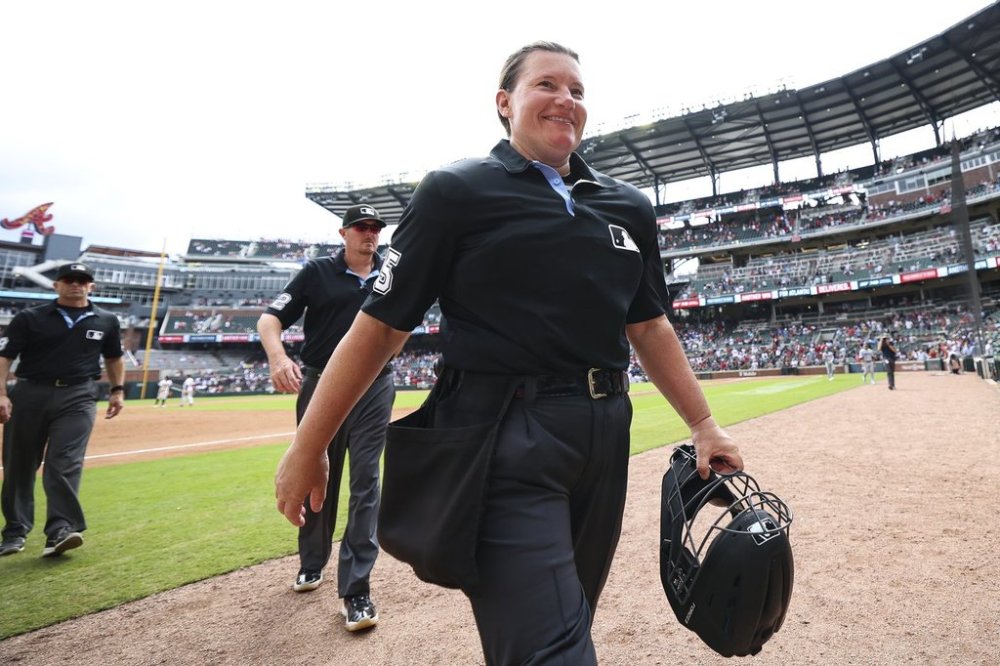 Home plate umpire Jen Pawol walks off the field after completing her first baseball game, between the Miami Marlins and the Atlanta Braves, Sunday, Aug. 10, 2025, in Atlanta. (AP Photo/Colin Hubbard)