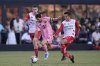 Inter Miami forward Lionel Messi, center, charges through Necaxa forward Raul Sanchez, left, and midfielder Jose Rodriguez, during the first half of a Leagues Cup soccer match, Saturday, Aug. 2, 2025, in Fort Lauderdale, Fla. (AP Photo/Rebecca Blackwell)