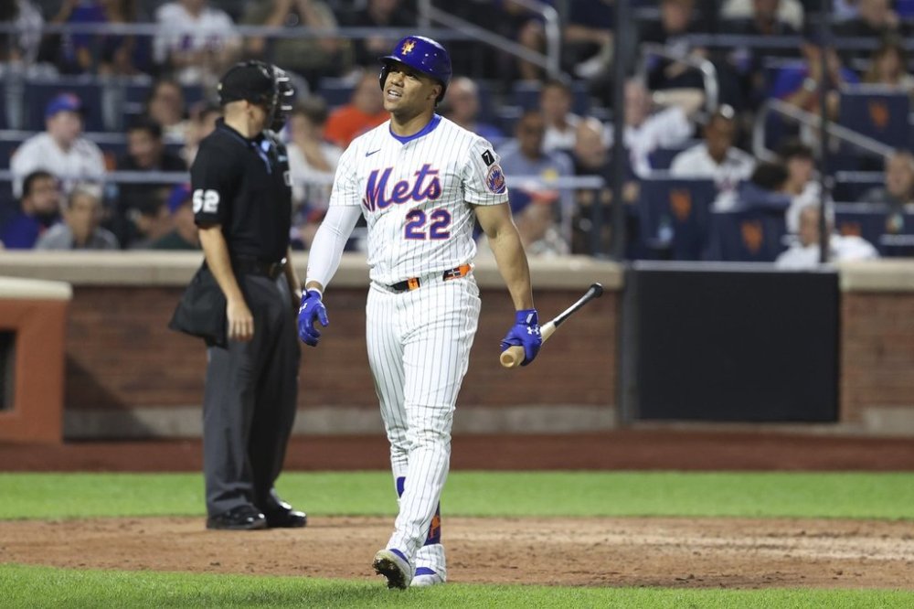New York Mets' Juan Soto reacts after being struck out by Miami Marlins pitcher Cade Gibson during the seventh inning of a baseball game Thursday, Aug. 28, 2025, in New York. (AP Photo/Pamela Smith)