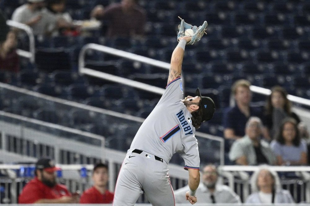 Miami Marlins third baseman Connor Norby makes a catch on a pop-up by Washington Nationals' Luis Garcia Jr. for an out during the seventh inning of a baseball game, Tuesday, Sept. 2, 2025, in Washington. (AP Photo/Nick Wass)