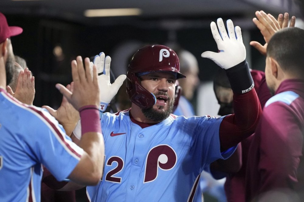 Philadelphia Phillies' Kyle Schwarber reacts after hitting a two-run home run against Atlanta Braves pitcher Austin Cox during the fourth inning of a baseball game Thursday, Aug. 28, 2025, in Philadelphia. (AP Photo/Matt Slocum)