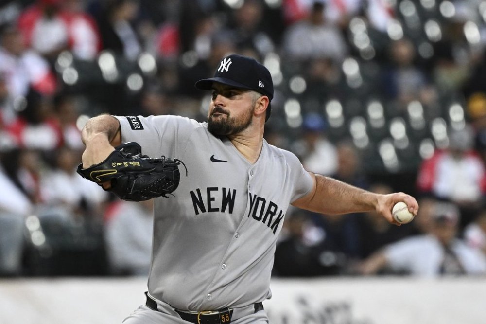New York Yankees pitcher Carlos Rodón delivers during the first inning of a baseball game against the Chicago White Sox, Friday, Aug. 29, 2025, in Chicago. (AP Photo/Matt Marton)