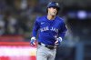 Toronto Blue Jays' Ernie Clement runs the bases after hitting a home run during the eighth inning of a baseball game against the Los Angeles Dodgers, Saturday, Aug. 9, 2025, in Los Angeles. (AP Photo/Jessie Alcheh)