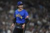 Seattle Mariners starting pitcher Bryan Woo reacts after Athletics' Lawrence Butler hit into a double play to end the top of the seventh inning of a baseball game Friday, Aug. 22, 2025, in Seattle. (AP Photo/Lindsey Wasson)