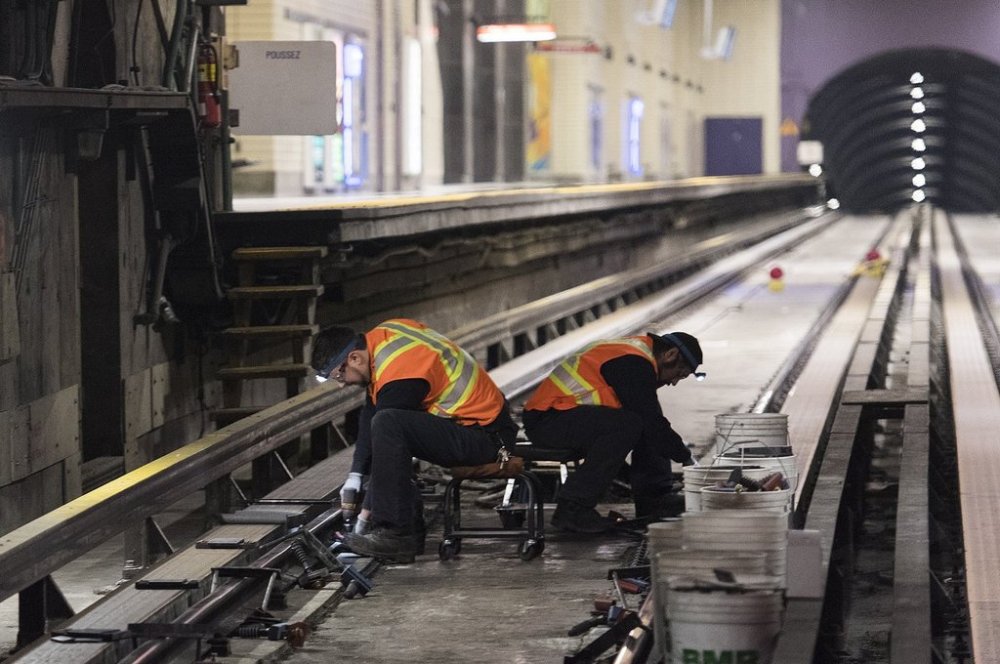 Employees busy at work in the Montreal metro. Photo taken on April 11, 2019. THE CANADIAN PRESS/Graham Hughes (Graham Hughes/THE CANADIAN PRESS)