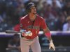 Arizona Diamondbacks' Ketel Marte pops out to Colorado Rockies relief pitcher Juan Mejia to end a baseball game Sunday, Aug. 17, 2025, in Denver. (AP Photo/David Zalubowski)