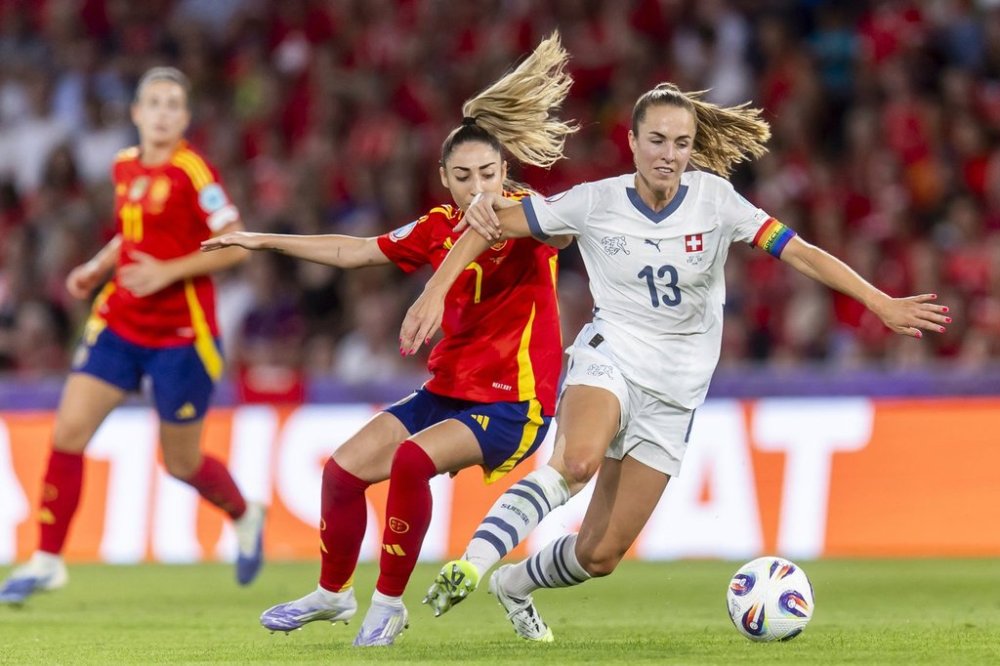 FILE - Spain's Olga Carmona, left, and Switzerland's Lia Waelti battle for the ball during the Women's Euro 2025 quarterfinal soccer match between Switzerland and Spain at Wankdorf stadium in Bern, Switzerland, Friday July 18, 2025. (Peter Klaunzer/Keystone via AP, File)