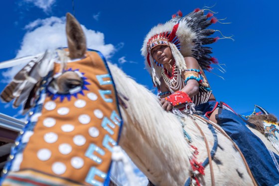 Fourteen year-old Mylan Archuleta of Ohkay Owingeh village in northern New Mexico prepares for the horse parade at the 40th anniversary of the Gathering of Nations powwow in Albuquerque, New Mexico, on April 28, 2023. (Roberto E. Rosales / The Associated Press files)
