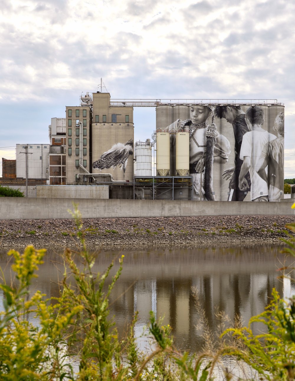 In this undated photo provided by Guido van Helten is a mural he painted on silos in Mankato, Minn. (Guido van Helten via AP)