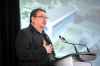 MIKAELA MACKENZIE / WINNIPEG FREE PRESS



Chief David Monias speaks at the Exchange Income Corp. annual meeting in the Calm Air hangar, with a photo of the planned Gary Filmon Indigenous Terminal behind him, in Winnipeg on Wednesday, May 11, 2022. For Martin Cash story.

Winnipeg Free Press 2022.
