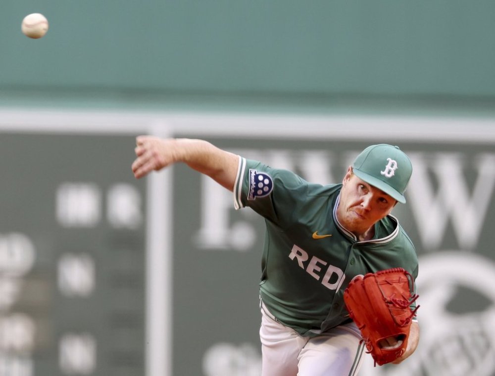 FILE - Boston Red Sox pitcher Hunter Dobbins throws during the first inning of a baseball game against the Tampa Bay Rays, July 11, 2025, in Boston. (AP Photo/Mark Stockwell, File)