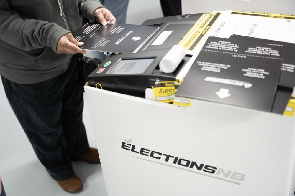 A voter casts their ballot in the New Brunswick provincial election at a polling location in Fredericton on Monday, Oct. 21, 2024. THE CANADIAN PRESS/Darren Calabrese