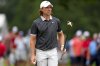 Tommy Fleetwood, of England, walks on the 17th green during the second round of the Tour Championship golf tournament, Friday, Aug. 22, 2025, in Atlanta. (AP Photo/Mike Stewart)
