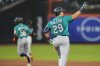 Seattle Mariners' Cal Raleigh (29) reacts after hitting a two-run home run during the third inning of a baseball game against the New York Mets, Friday, Aug. 15, 2025, in New York. (AP Photo/Yuki Iwamura)