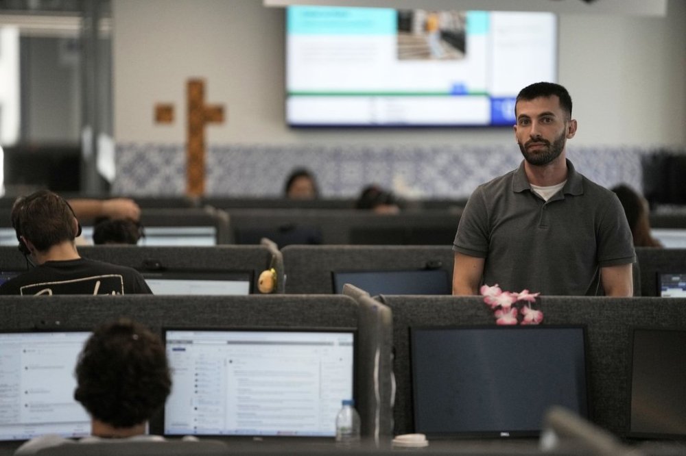 Armen Kirakosian, Global Senior Manager, Learning & Development TTEC poses in Athens, Greece, Thursday, Aug. 21, 2025. (AP Photo/Thanassis Stavrakis)