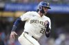 Milwaukee Brewers' Christian Yelich rounds third base on his way to scoring on a two-run RBI double hit by Blake Perkins during the first inning of a baseball game against the Philadelphia Phillies, Monday, Sept. 1, 2025, in Milwaukee. (AP Photo/Kayla Wolf)