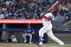 Blue Jays first baseman Vladimir Guerrero Jr. (27) hits a single against the Texas Rangers in the first inning of a Major League Baseball game in Toronto on Sunday, Aug. 17, 2025. THE CANADIAN PRESS/Jon Blacker