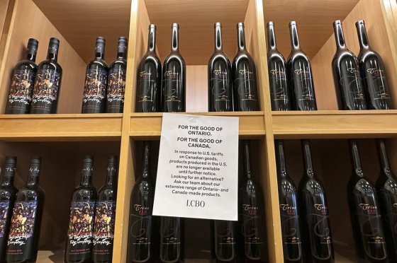 A sign posted on a wine shelves at an LCBO in Toronto in March. (Jill Colvin / The Associated Press files)