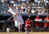 New York Yankees' Aaron Judge hits a two-run home run during the third inning of a baseball game against the Washington Nationals, Wednesday, Aug. 27, 2025, in New York. (AP Photo/Noah K. Murray)