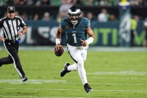 Philadelphia Eagles quarterback Jalen Hurts (1) runs the ball in the first half of an NFL football game against the Dallas Cowboys Thursday, Sept. 4, 2025, in Philadelphia. (AP Photo/Chris Szagola)