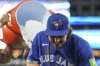 Blue Jays outfielder Addison Barger ducks away from an ice bucket thrown by teammates after defeating the Minnesota Twins in Major League Baseball action in Toronto on Wednesday, Aug. 27, 2025. THE CANADIAN PRESS/Chris Young