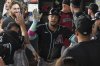 Arizona Diamondbacks second baseman Ketel Marte, center, celebrates in the dugout after hitting a solo home run in the ninth inning of a baseball game against the Texas Rangers Tuesday, Aug. 12, 2025, in Arlington, Texas. (AP Photo/Tony Gutierrez)