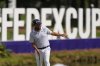 J.J. Spaun reacts to a missed putt on the 14th green during the final round of the St. Jude Championship golf tournament Sunday, Aug. 10, 2025, in Memphis, Tenn. (AP Photo/George Walker IV)