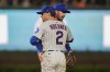 Chicago Cubs second baseman Nico Hoerner (2) and shortstop Dansby Swanson (7) celebrate their team's win over the Milwaukee Brewers in the second baseball game of a split doubleheader Tuesday, Aug. 19, 2025, in Chicago. (AP Photo/Erin Hooley)