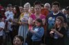 People gather at a vigil at Lynnhurst Park after a shooting at the Annunciation Catholic School Wednesday, Aug. 27, 2025, in Minneapolis. (AP Photo/Bruce Kluckhohn)