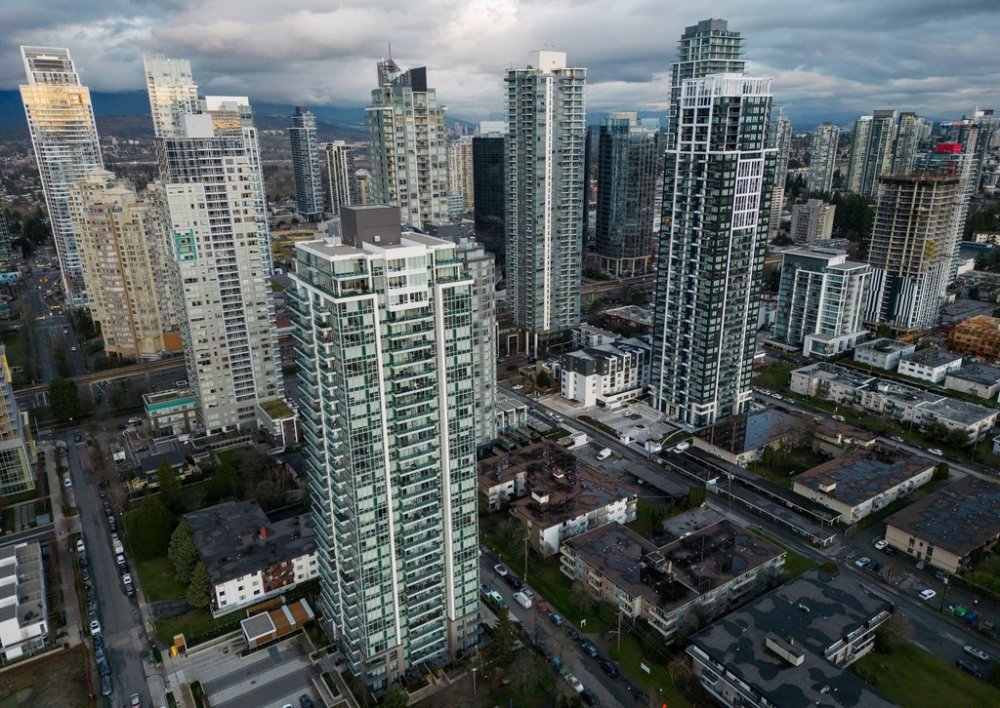 Condo buildings tower above older two and three-storey walk-up apartment buildings, in Burnaby, B.C., on Wednesday, Dec. 18, 2024. THE CANADIAN PRESS/Darryl Dyck