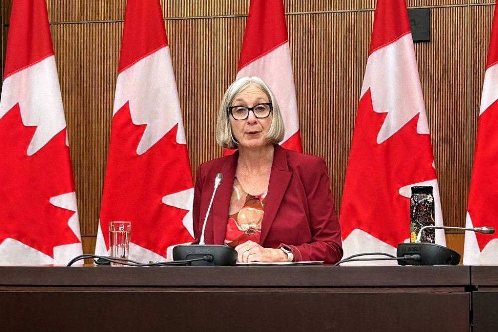 Jobs Minister Patty Hajdu is seen at a press conference where she announced that she directed the Canada Industrial Relations Board to order Air Canada and the union representing its flight attendants to resume operations and resolve the dispute through binding arbitration, in Ottawa, Saturday, Aug. 16, 2025. THE CANADIAN PRESS/Kyle Duggan