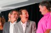Louisiana Gov. Jeff Landry, center, stands between LIV CEO Scott O'Neil, left, and golfer Bubba Watson during a press event, Wednesday, Aug. 27, 2025, in New Orleans, announcing the LIV Golf Louisiana tournament in New Orleans next year. (John McCusker/The Times-Picayune/The New Orleans Advocate via AP)