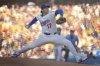 Los Angeles Dodgers designated hitter Shohei Ohtani throws to the plate during the first inning of a baseball game against the Cincinnati Reds, Wednesday, Aug. 27, 2025, in Los Angeles. (AP Photo/Mark J. Terrill)