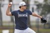 FILE - New York Yankees pitcher Gerrit Cole throws to second base doing pickoff drills during a spring training baseball workout, Feb. 20, 2025, in Tampa, Fla. (AP Photo/Chris O'Meara, File)