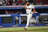 Cleveland Guardians' Jose Ramirez gestures as he runs to home plate with a home run in the eighth inning of a baseball game against the Miami Marlins in Cleveland, Tuesday, Aug. 12, 2025. (AP Photo/Sue Ogrocki)