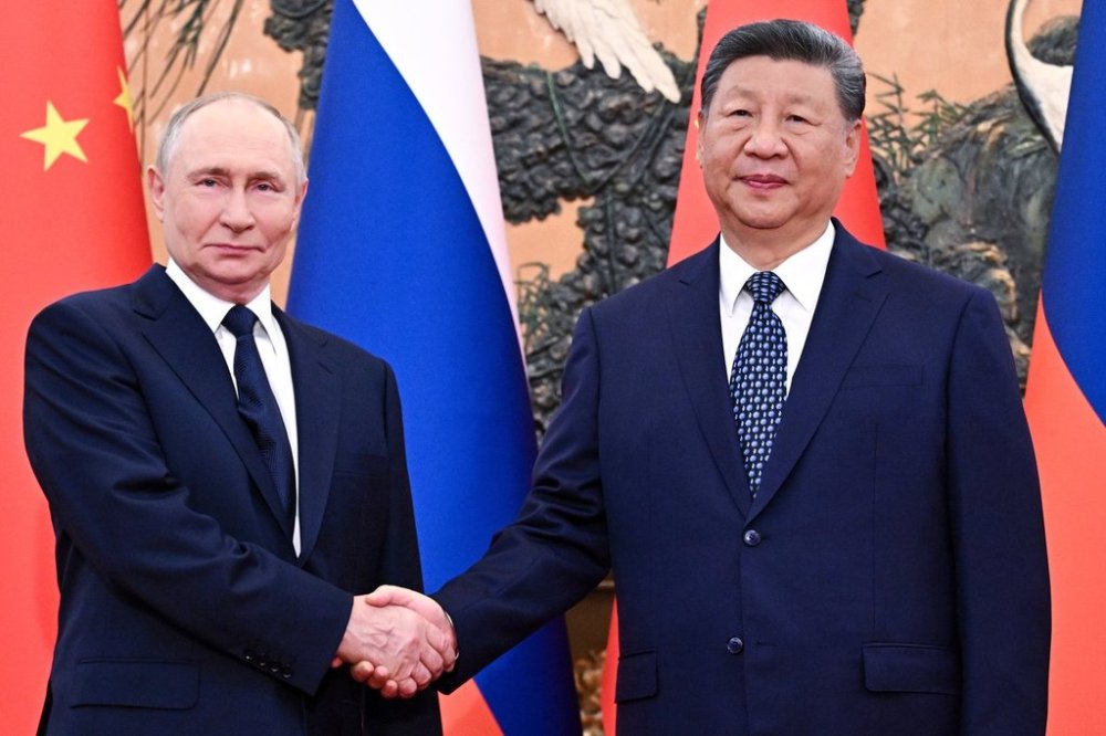 Russian President Vladimir Putin, left, and Chinese President Xi Jinping shake hands ahead of their meeting at The Great Hall of the People in Beijing, China, Tuesday, Sept. 2, 2025. (Sergei Bobylev, Sputnik, Kremlin Pool Photo via AP)