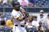 Pittsburgh Pirates' Isiah Kiner-Falefa hits an RBI double during the fourth inning of a baseball game against the Cincinnati Reds, Sunday, Aug. 10, 2025, in Pittsburgh. (AP Photo/Matt Freed)