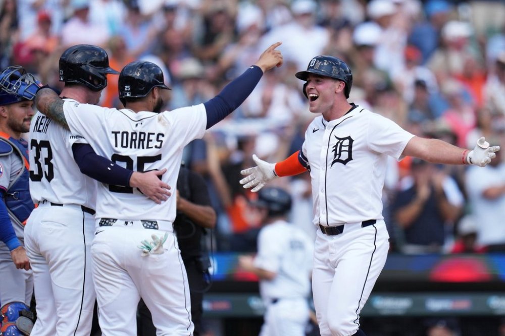 CORRECTS INNING TO SEVENTH, NOT EIGHTH - Detroit Tigers designated hitter Kerry Carpenter, right, celebrates with Colt Keith, left, and Gleyber Torres, after hitting a three-run home run during the seventh inning of a baseball game against the New York Mets, Wednesday, Sept. 3, 2025, in Detroit. (AP Photo/Ryan Sun)