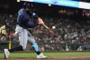 Tampa Bay Rays' Yandy Díaz hits an RBI single during the ninth inning of a baseball game against the San Francisco Giants, Friday, Aug. 15, 2025, in San Francisco. (AP Photo/Godofredo A. Vásquez)