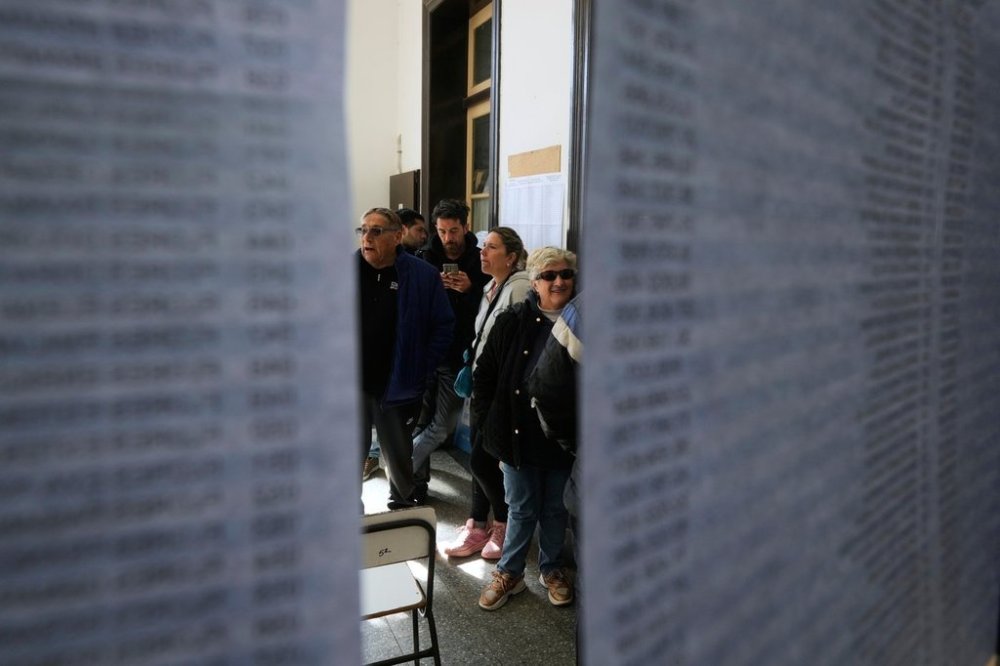 People line up to vote during legislative provincial elections in La Plata, Argentina, Sunday, Sept. 7, 2025. (AP Photo/Gustavo Garello)