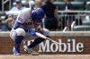 New York Mets' Brett Baty reacts after a striking out during the fifth inning of a baseball game against the Atlanta Braves, Sunday, Aug. 24, 2025, in Atlanta. (AP Photo/Butch Dill)
